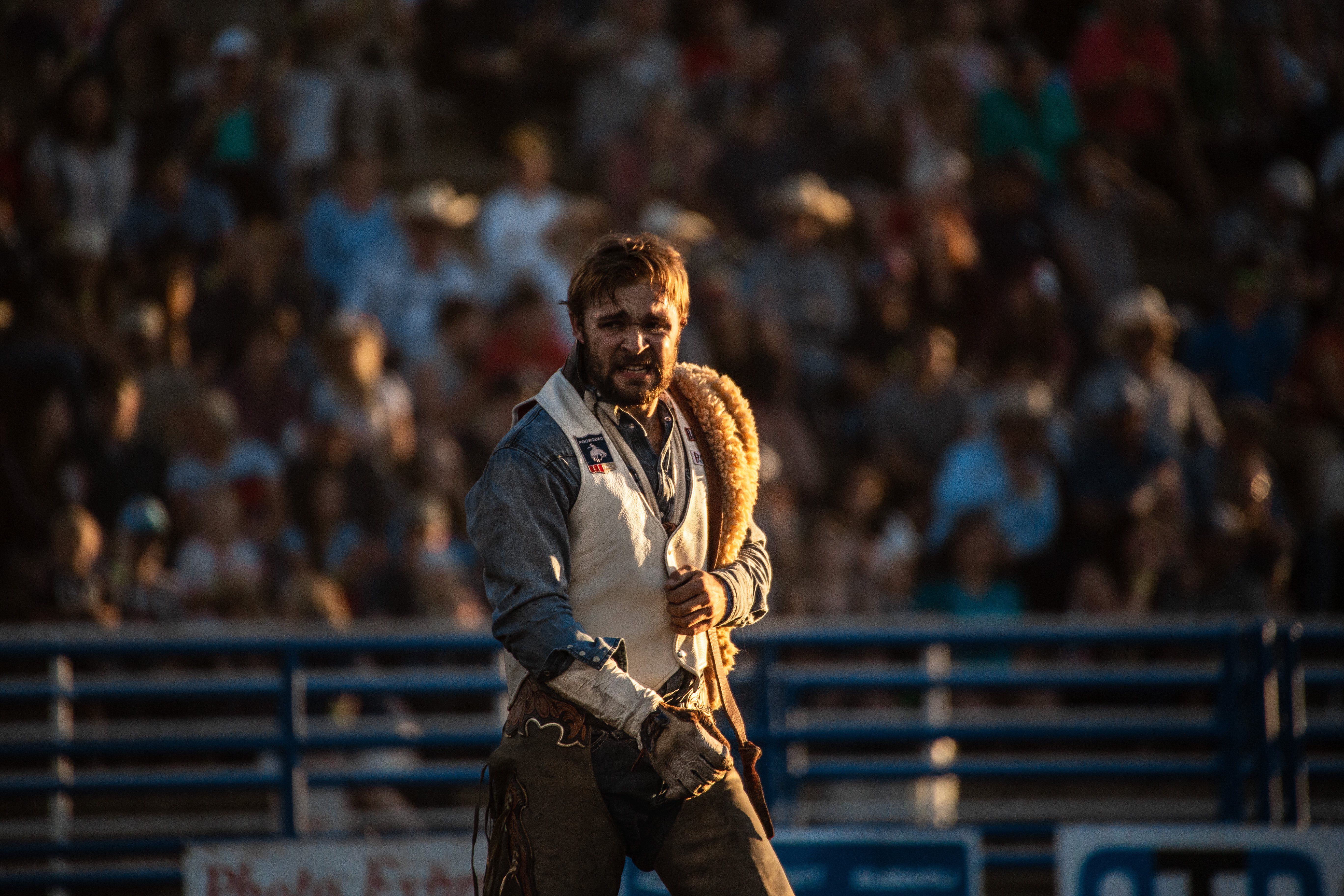 Golden-hour portrait of a rodeo bronc rider