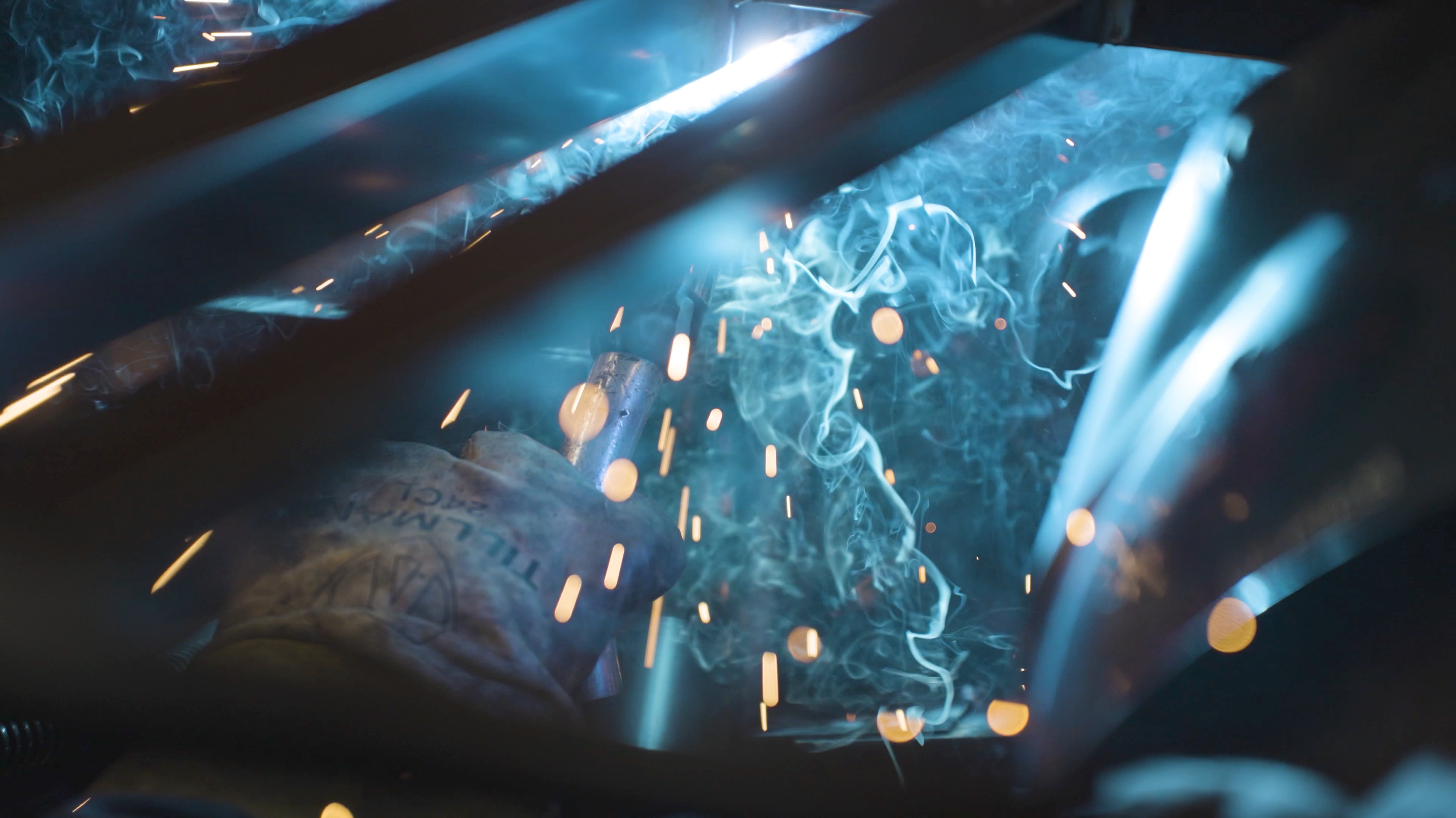 Close-up of welding arc, smoke and sparks